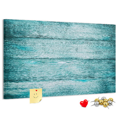 Kurkbord met achtergrond van groene en blauwe houten planken