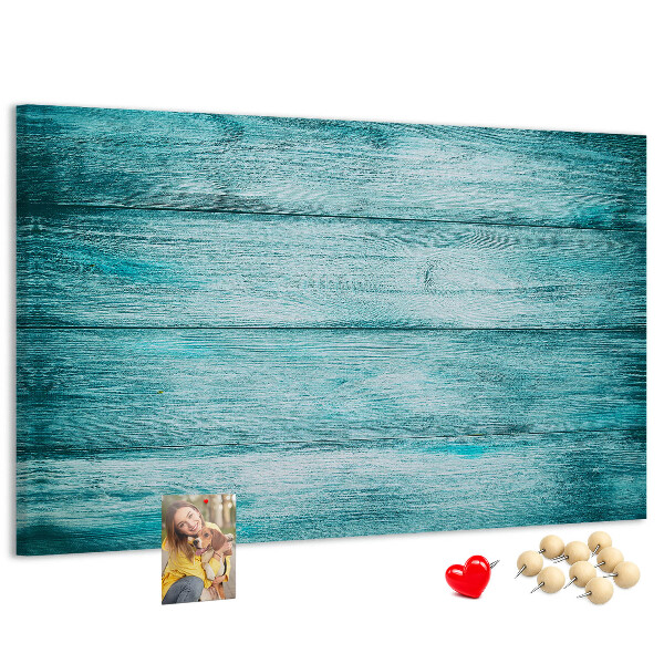 Kurkbord met achtergrond van groene en blauwe houten planken