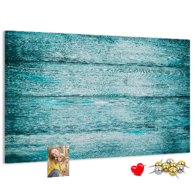 Kurkbord met achtergrond van groene en blauwe houten planken
