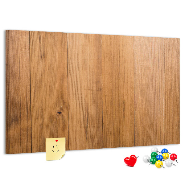 Prikbord van hout met gekleurde pinnen