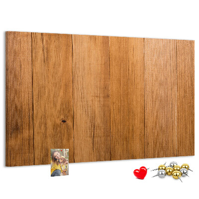 Prikbord van hout met gekleurde pinnen