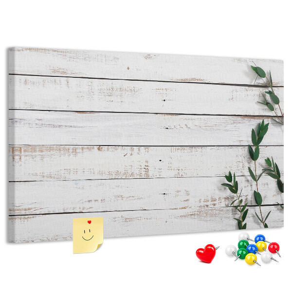 Kurk prikbord met rustiek hout en groene takken