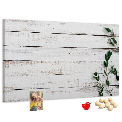 Kurk prikbord met rustiek hout en groene takken