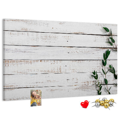 Kurk prikbord met rustiek hout en groene takken
