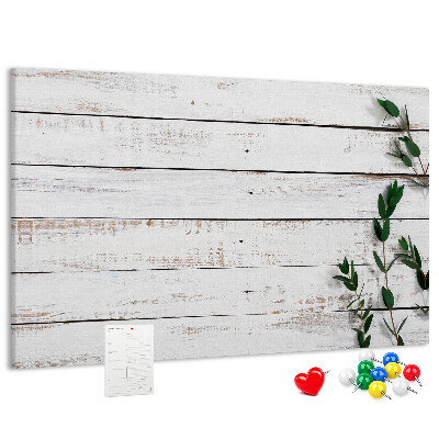 Kurk prikbord met rustiek hout en groene takken