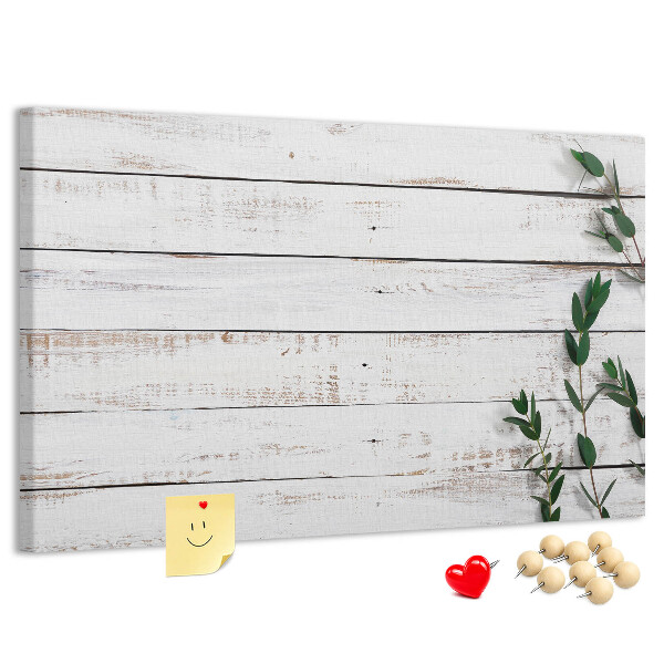 Kurk prikbord met rustiek hout en groene takken