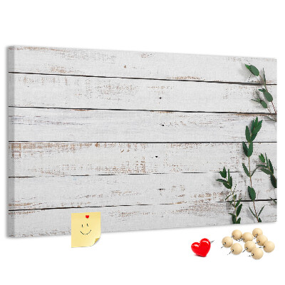 Kurk prikbord met rustiek hout en groene takken