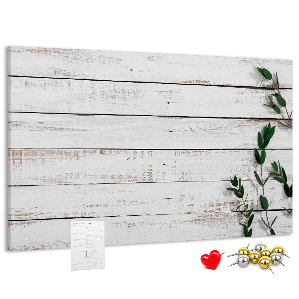 Kurk prikbord met rustiek hout en groene takken
