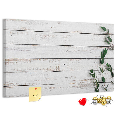 Kurk prikbord met rustiek hout en groene takken