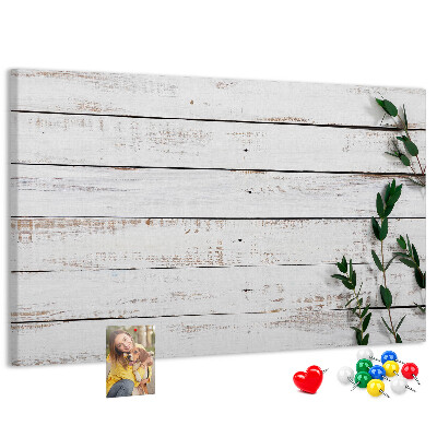 Kurk prikbord met rustiek hout en groene takken