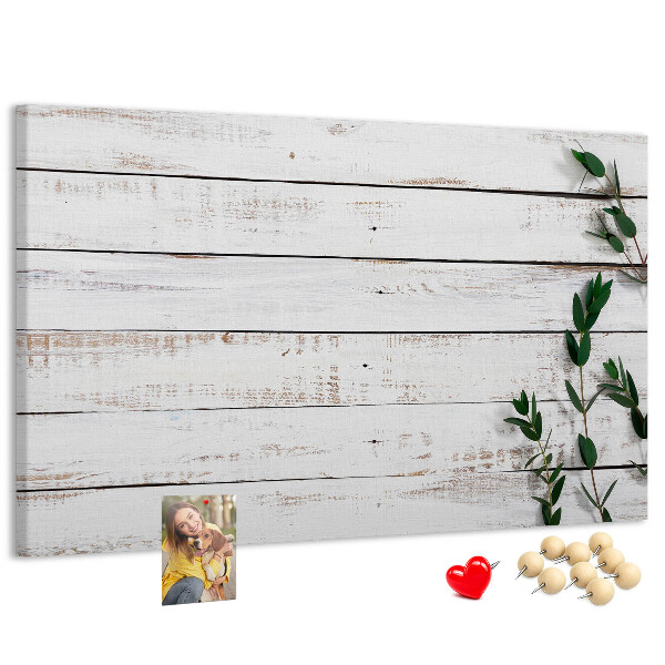 Kurk prikbord met rustiek hout en groene takken