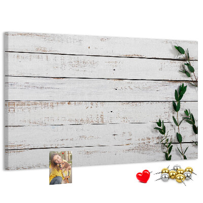 Kurk prikbord met rustiek hout en groene takken