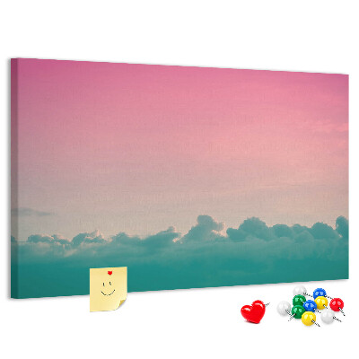 Prikbord zonsondergang boven de wolken in pastelkleuren
