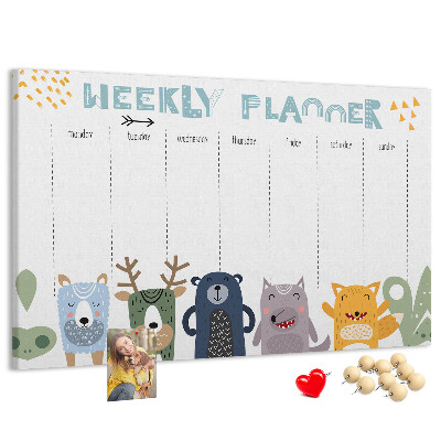 Kurkbord met kleurrijke weekplanner en dierenprint