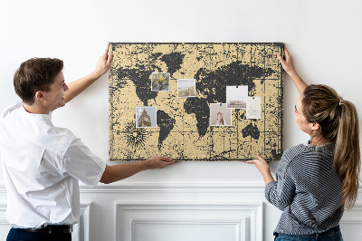 Prikbord met een oude wereldkaart in zwart en goud