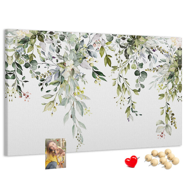 Kurken prikbord met een motief van groene bladeren en tere bloemen