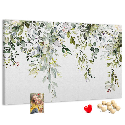 Kurken prikbord met een motief van groene bladeren en tere bloemen