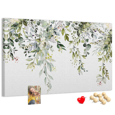Kurken prikbord met een motief van groene bladeren en tere bloemen