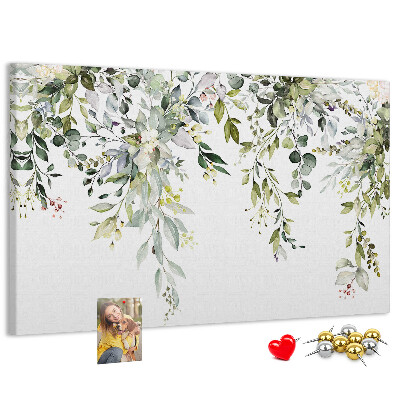 Kurken prikbord met een motief van groene bladeren en tere bloemen