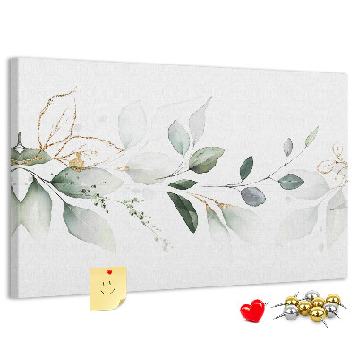 Prikbord met fijne blaadjes en gouden accenten