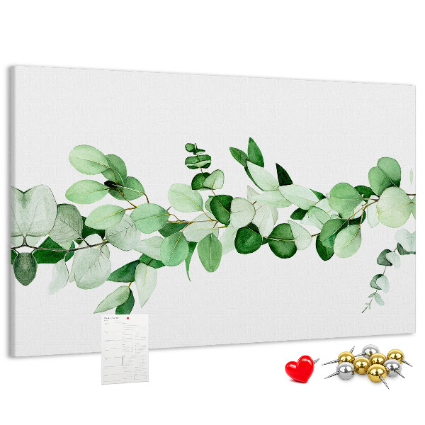 Prikbord met groene bladeren op een lichte achtergrond
