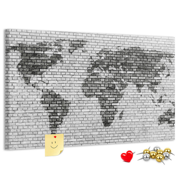 Wereldkaart op een bakstenen muur prikbord