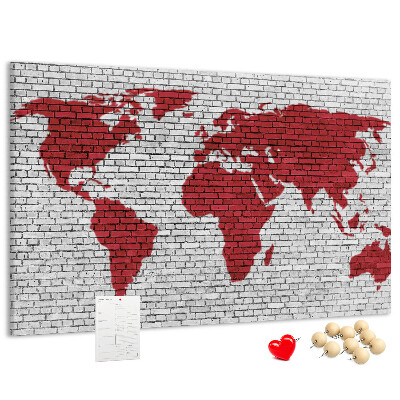 Kurkbord met afbeelding van de wereld op een bakstenen muur