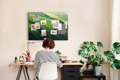 Kurken prikbord met een patroon van groene golven en aardse texturen