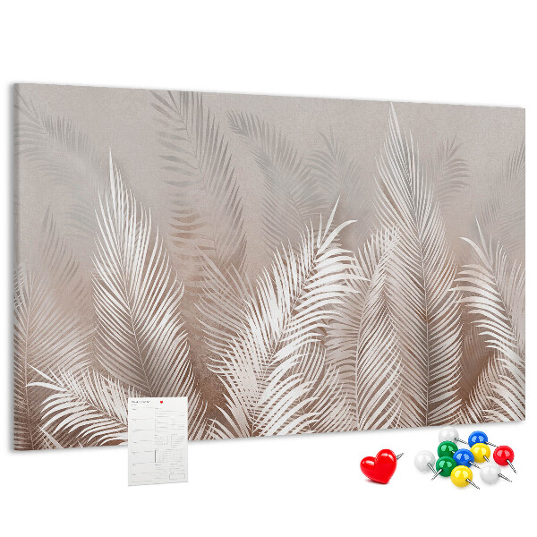 Prikbord met fijne palmbladeren op een neutrale achtergrond