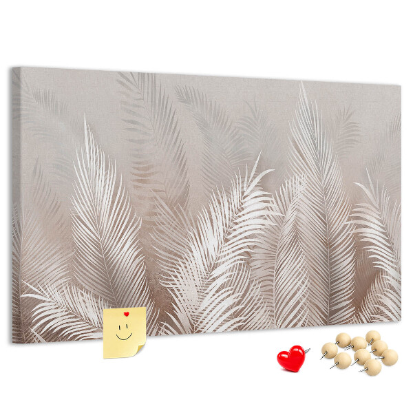 Prikbord met fijne palmbladeren op een neutrale achtergrond