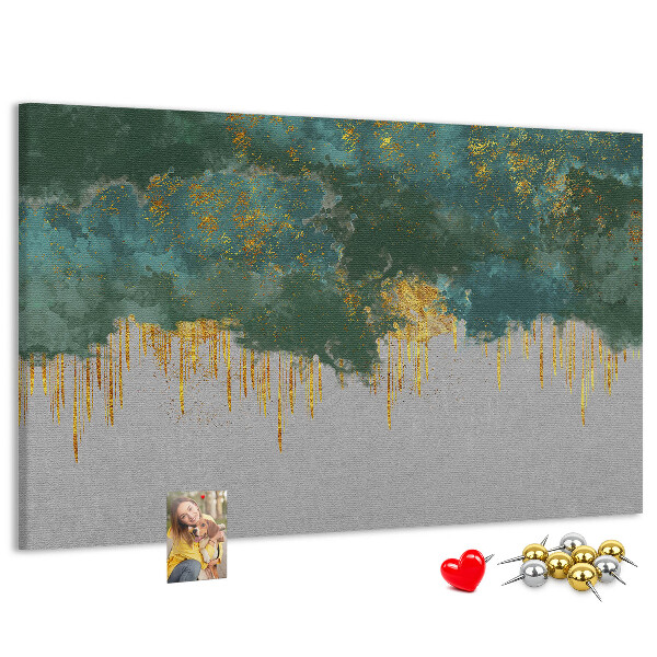 Prikbord met gouden druppels op een blauwe wolkenachtergrond