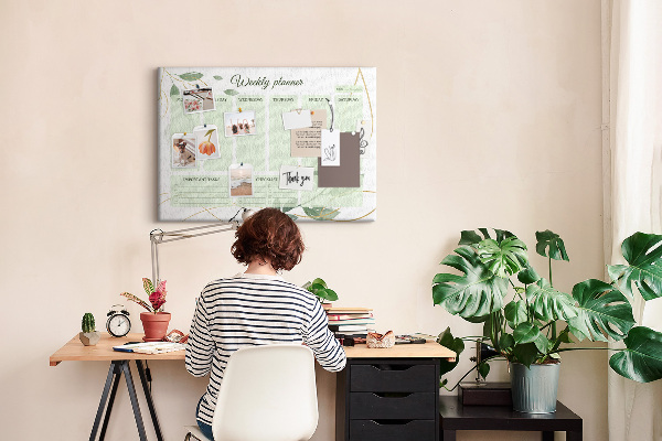 Prikbord groene weekplanner met plantenaccenten