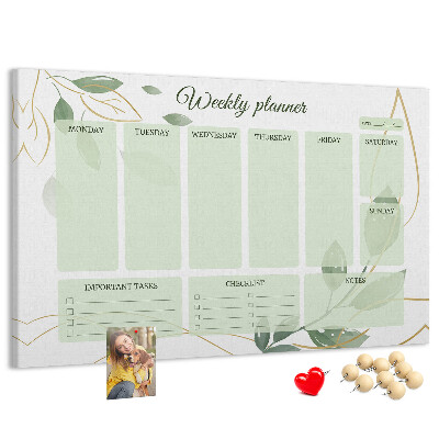 Prikbord groene weekplanner met plantenaccenten