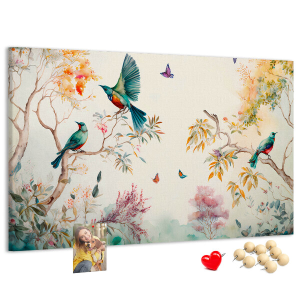 Prikbord met een afbeelding van kleurrijke vogels in een lentelandschap