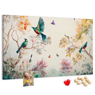 Prikbord met een afbeelding van kleurrijke vogels in een lentelandschap