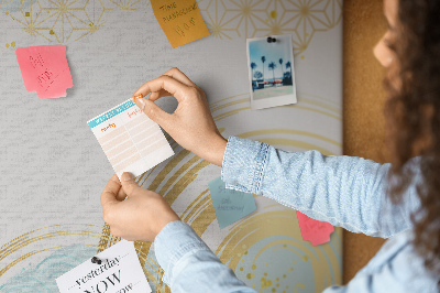 Prikbord met gouden spiralen op een blauwe achtergrond