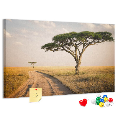 Prikbord met een Afrikaans landschap van een weg met een boom