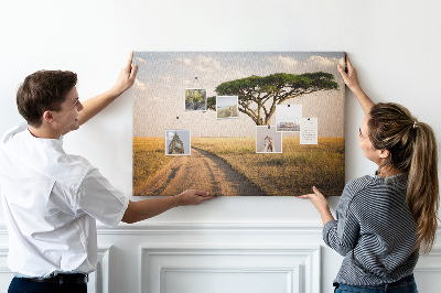 Prikbord met een Afrikaans landschap van een weg met een boom