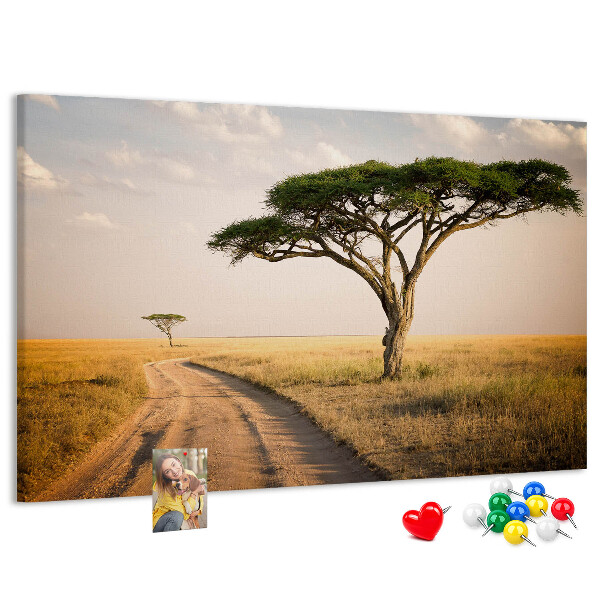 Prikbord met een Afrikaans landschap van een weg met een boom