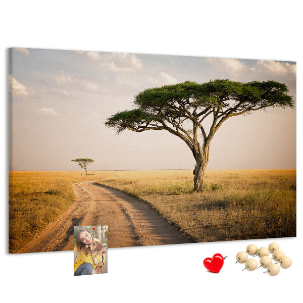 Prikbord met een Afrikaans landschap van een weg met een boom