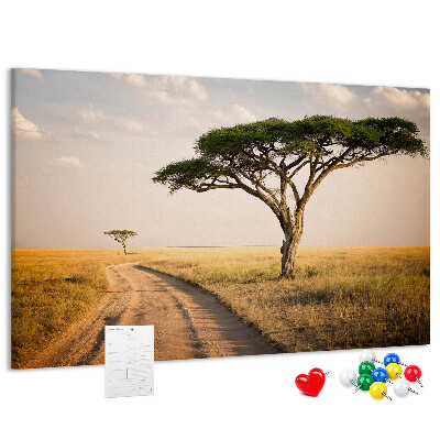 Prikbord met een Afrikaans landschap van een weg met een boom