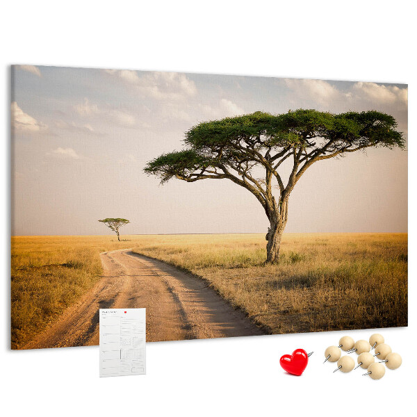 Prikbord met een Afrikaans landschap van een weg met een boom