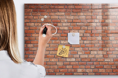 Memobord van glas met print inclusief neodymium magneten Een prikbord aan een bakstenen muur