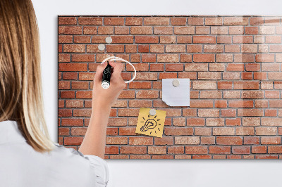 Memobord van glas met print inclusief neodymium magneten Een prikbord aan een bakstenen muur