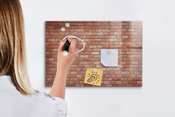 Memobord van glas met print inclusief neodymium magneten Een prikbord aan een bakstenen muur