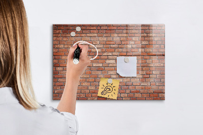 Memobord van glas met print inclusief neodymium magneten Een prikbord aan een bakstenen muur
