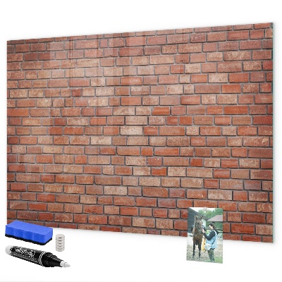 Memobord van glas met print inclusief neodymium magneten Een prikbord aan een bakstenen muur