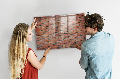 Memobord van glas met print inclusief neodymium magneten Een prikbord aan een bakstenen muur