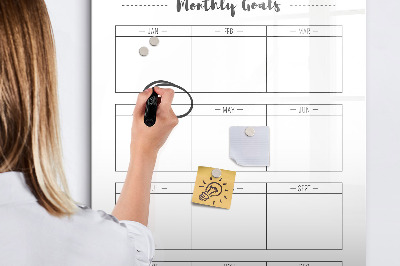 Decoratief glazen wandbord beschrijfbaar en magnetisch Maandelijkse doelen met de mogelijkheid om ze te personaliseren.