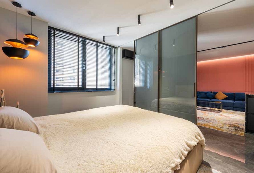 Hoe de woonkamer met de slaapkamer verzoenen?